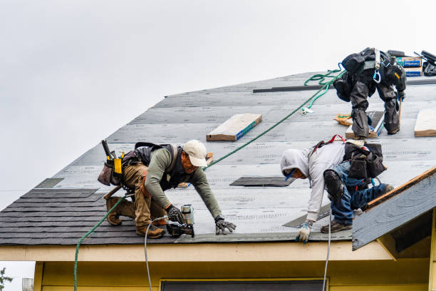 Professional Roofing technician working in Arverne, NY
